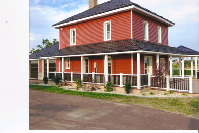 Farmhouse home design photo in Toronto