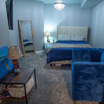 Basement Utilizing Open Space to Shoot Pool and Watch Favorite Sports Team