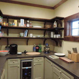 Small contemporary kitchen pantry designs - Small trendy u-shaped concrete floor kitchen pantry photo in Kansas City with shaker cabinets, gray cabinets and solid surface countertops