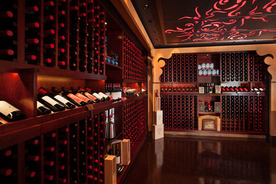 Design ideas for a large asian wine cellar in Vancouver with concrete floors, storage racks and brown floor.