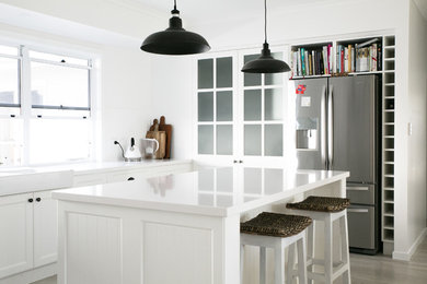 Inspiration for a mid-sized beach style kitchen in Brisbane with with island.