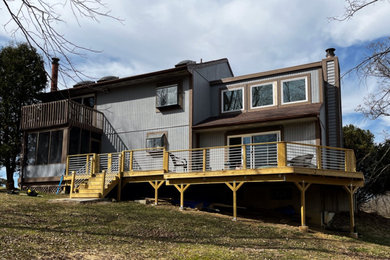 Inspiration for a large craftsman backyard metal railing deck remodel in Cincinnati