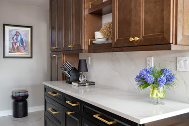 Enclosed kitchen - small transitional galley porcelain tile and white floor enclosed kitchen idea in New York with an undermount sink, recessed-panel cabinets, brown cabinets, quartz countertops, white backsplash, quartz backsplash, stainless steel appliances, no island and white countertops