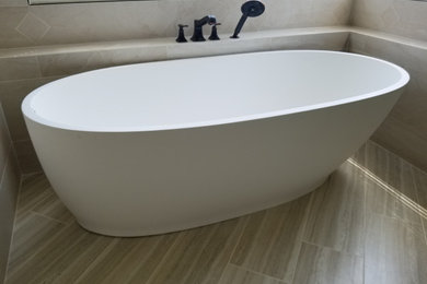 Example of a beach style porcelain tile and beige floor bathroom design in Los Angeles