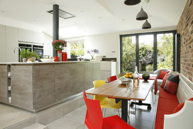 This is an example of a mid-sized contemporary kitchen/dining combo in Hertfordshire.