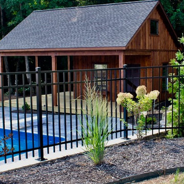 Aluminum fence protecting backyard pool photo