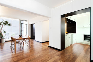 This is an example of a contemporary dining room in Melbourne.