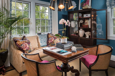 Home office library - mid-sized eclectic dark wood floor home office library idea in Louisville with blue walls