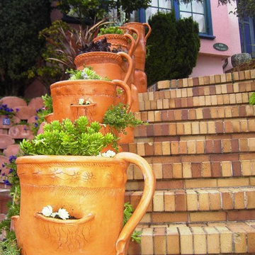 Front Yard with Artistic Driveway, Custom Sculptures, Planted Walls