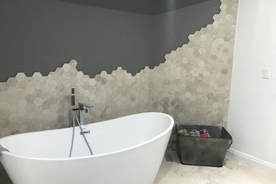 Inspiration for a large contemporary master gray tile and porcelain tile porcelain tile and gray floor bathroom remodel in San Diego with gray walls, a vessel sink, quartz countertops and white countertops