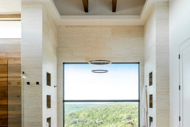 Imagen de cuarto de baño doble contemporáneo con puertas de armario grises, bañera encastrada, suelo de travertino y vigas vistas