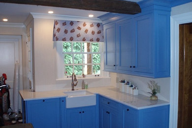 Inspiration for a timeless eat-in kitchen remodel in Cleveland with beaded inset cabinets, blue cabinets, quartz countertops and an island