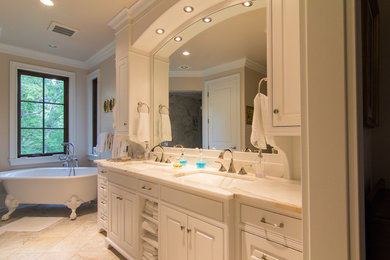 Design ideas for a large traditional master bathroom in Other with an undermount sink, recessed-panel cabinets, white cabinets, granite benchtops, a claw-foot tub, white tile and white walls.