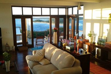 Eclectic dark wood floor sunroom photo in Other