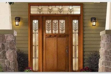 Mid-sized traditional front door in Chicago with green walls, a single front door and a medium wood front door.