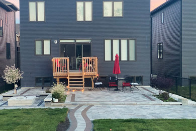 Huge minimalist stone patio photo in Toronto