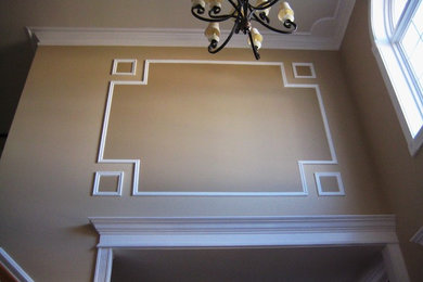Entryway - traditional entryway idea in New York with brown walls