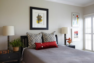 This is an example of a mid-sized transitional guest bedroom in Birmingham with beige walls and no fireplace.