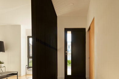 Single front door - modern single front door idea in Montreal with a black front door