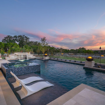 Transitional Contemporary Pool with Negative Edge Spa