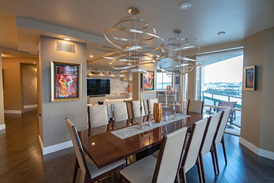 Inspiration for a contemporary brown floor and dark wood floor great room remodel in Los Angeles with beige walls