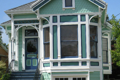 Mid-sized traditional green two-story wood exterior home idea in San Francisco