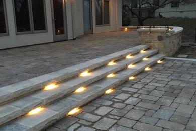 Example of a large classic backyard stone patio design in San Diego with no cover