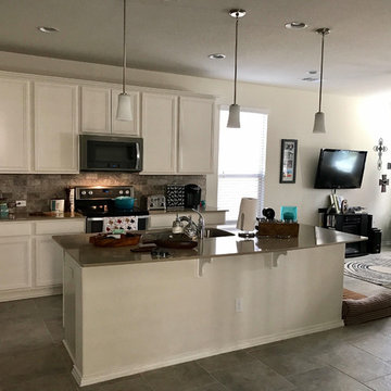 Open kitchen to living area. Utilized couple's existing items and added small p