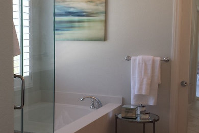 Mid-sized transitional master blue tile and ceramic tile marble floor corner shower photo in San Diego with recessed-panel cabinets, dark wood cabinets, solid surface countertops, an undermount tub and gray walls