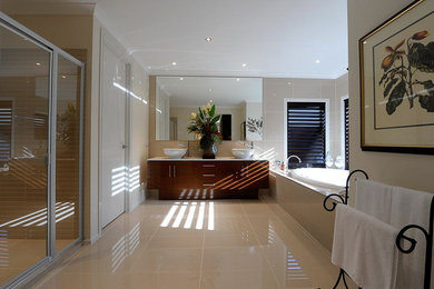 Mid-sized bathroom in Melbourne with beige tile, porcelain tile, beige walls and porcelain floors.