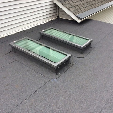 Self adhered rolled roofing and new skylights on aluminum three season room.