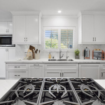 Streamlined Elegance in Laguna Niguel: All-White Kitchen with Integrated Cooktop