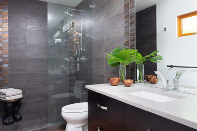 Example of a mid-sized transitional master gray tile and porcelain tile concrete floor and orange floor bathroom design in Vancouver with flat-panel cabinets, dark wood cabinets, a one-piece toilet, white walls, quartz countertops, gray countertops and a built-in vanity