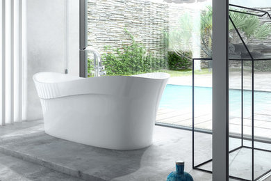 Photo of a mid-sized contemporary bathroom in London with a freestanding tub, marble floors and grey walls.