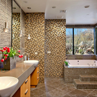 Inspiration for a contemporary master multicolored tile and mosaic tile brown floor bathroom remodel in Other with flat-panel cabinets, brown cabinets, a hot tub, brown walls and a drop-in sink