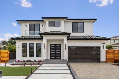 Contemporary white two-story house exterior idea in San Francisco with a hip roof, a metal roof and a black roof