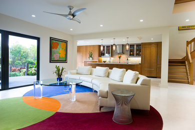 This is an example of a contemporary formal open concept living room in Miami with white walls and marble floors.