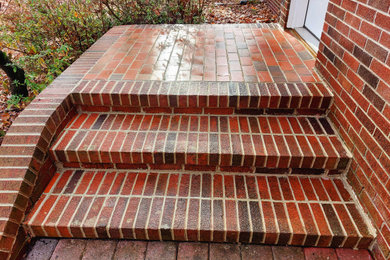 Entryway - brick floor entryway idea in Other