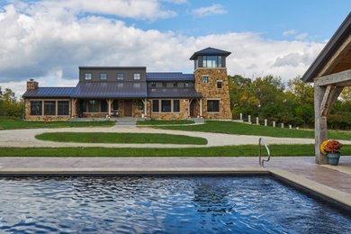 Photo of a country home design in Chicago.