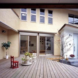 他の地域のアジアンスタイルのおしゃれなデッキ (日よけなし) の写真