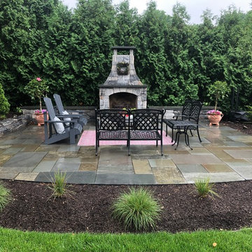 Bluestone Patio with Liberty thin veneer fireplace by Designscapes