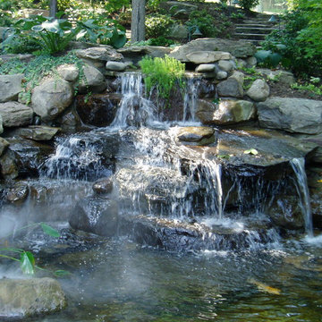 Grotto with pool house and running stream