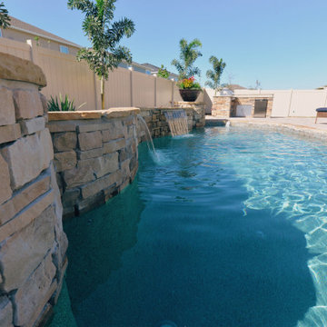 Custom Swimming Pool with Granite Tabletop and Spillway