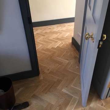 Installing Herringbone Wood Floor to Premises
