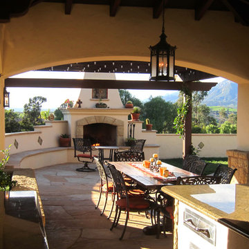 Spanish Style Covered Outdoor Dining with fireplace in Santa Barbara