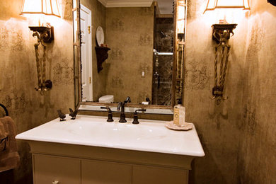 Inspiration for a small timeless powder room remodel in Sacramento with an integrated sink and furniture-like cabinets