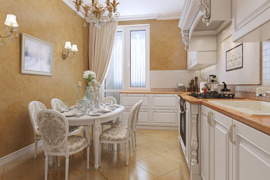 Mid-sized cottage chic l-shaped beige floor eat-in kitchen photo in Dallas with a drop-in sink, raised-panel cabinets, white cabinets, white backsplash, subway tile backsplash and no island