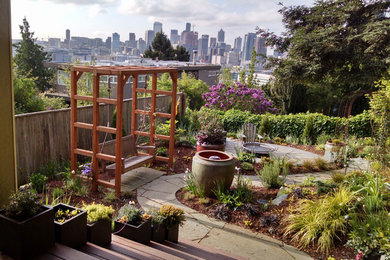 Photo of a mid-sized eclectic full sun backyard stone garden path in Seattle for summer.