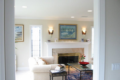 Example of a large classic formal and enclosed carpeted and white floor living room design in San Francisco with beige walls, a standard fireplace, a stone fireplace and no tv