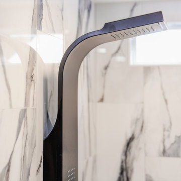 Bathroom remodeling in Columbia, MD with double vanity & marble bathtub